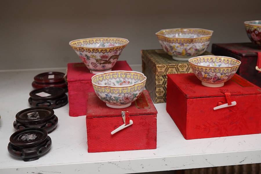 A collection of late 20th century Chinese boxed eggshell bowls, and four wood stands
